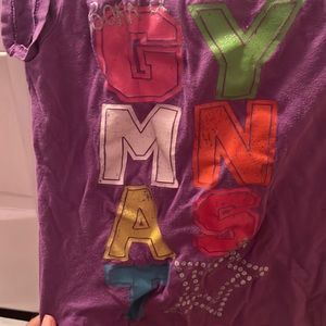 This a a shirt for a tiny!! It say’s  born a gymnast!very cute
